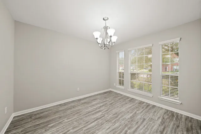 a view of a livingroom with wooden floor