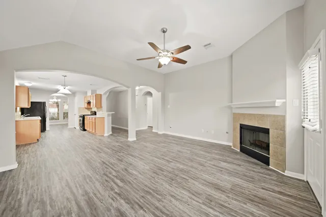 a view of a room with wooden floor