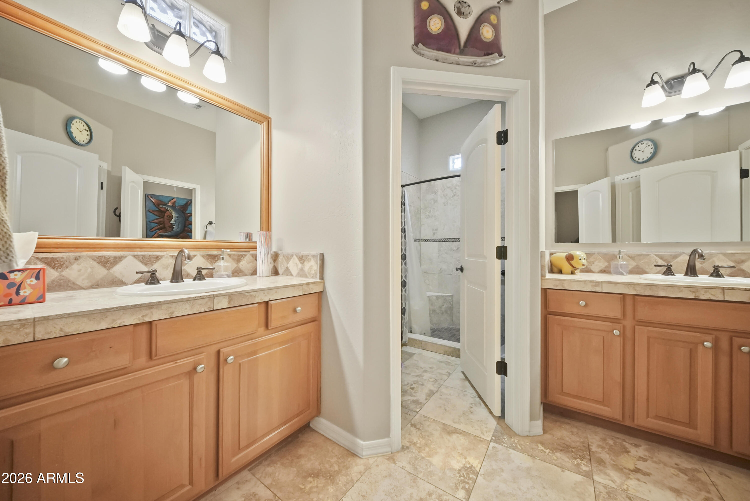605 West Ridgecrest Road Phoenix, AZ 85086 - Photo 32 of 40 a spacious bathroom with a granite countertop sink mirror and a