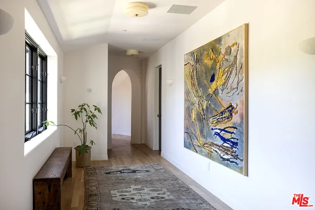 a bedroom with furniture and a window