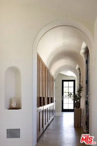 a dining room with furniture and a window