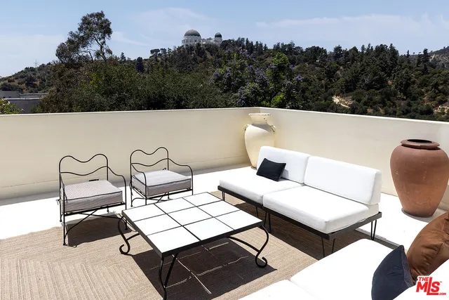 a bedroom with a bed chair and a window