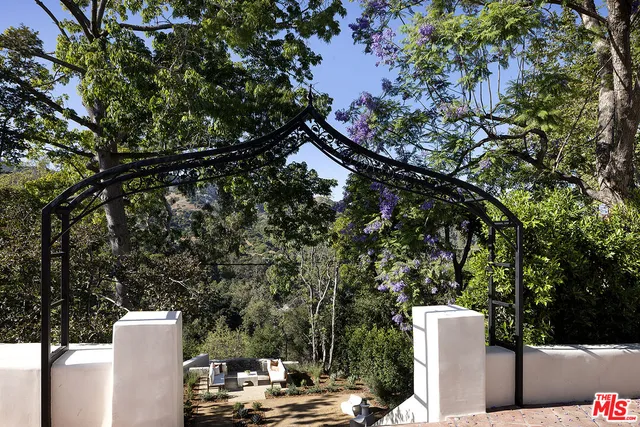 a backyard of a house with outdoor seating