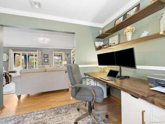 a view of a workspace with furniture