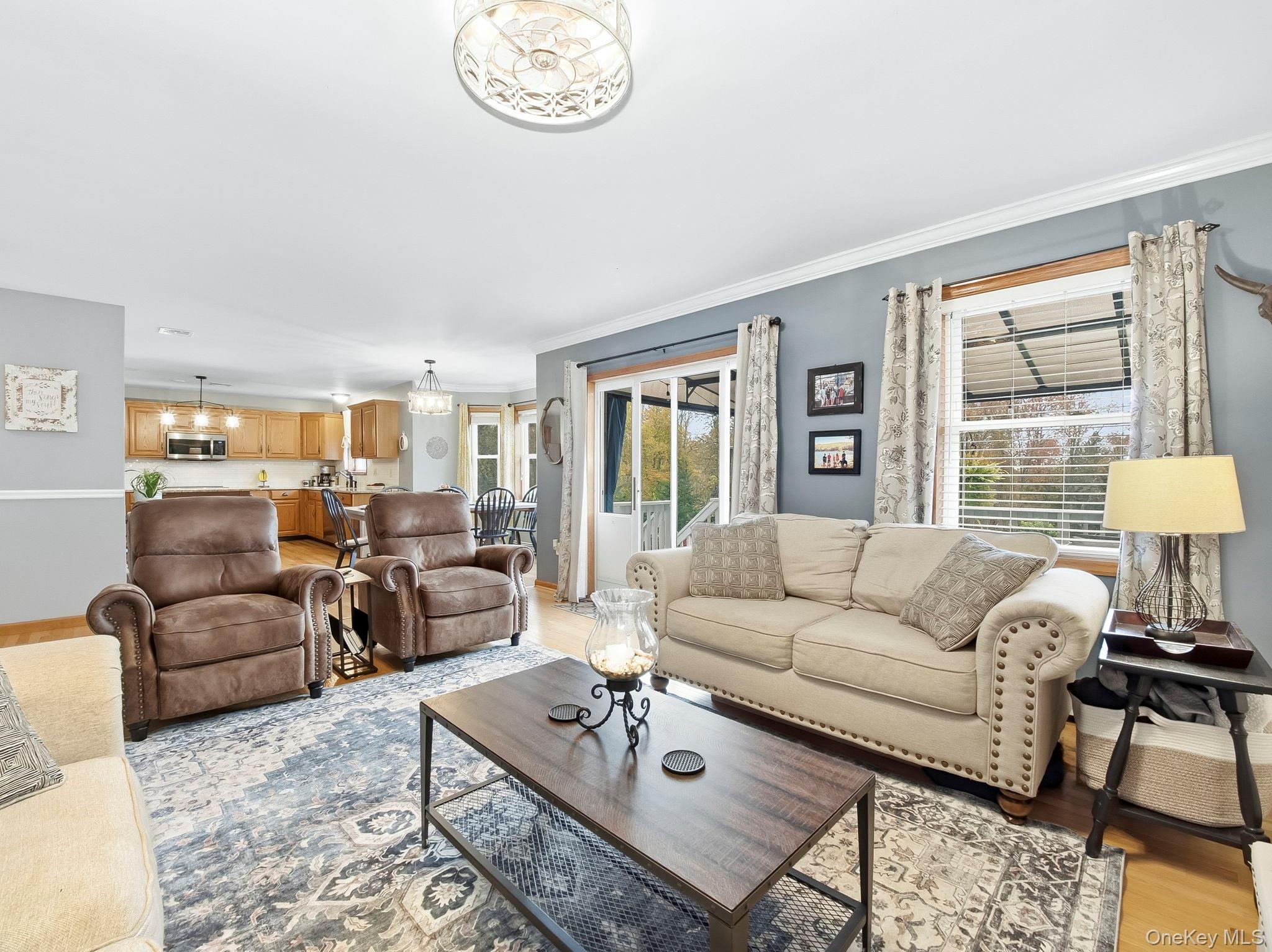 90 Reilly Road LaGrangeville, NY 12540 - Photo 16 of 50 a living room with furniture a table and a large window