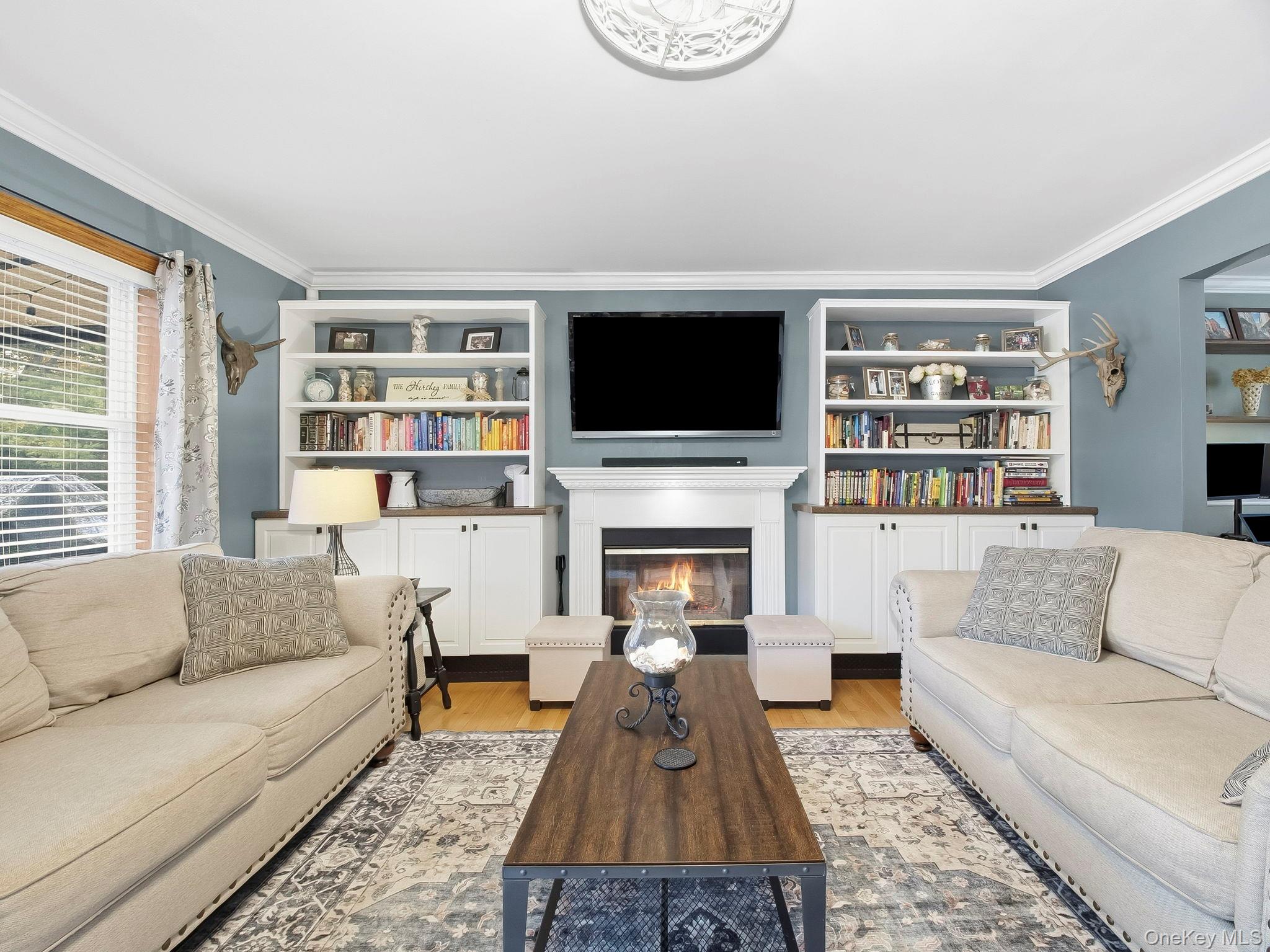 90 Reilly Road LaGrangeville, NY 12540 - Photo 17 of 50 a living room with furniture fireplace and a flat screen tv