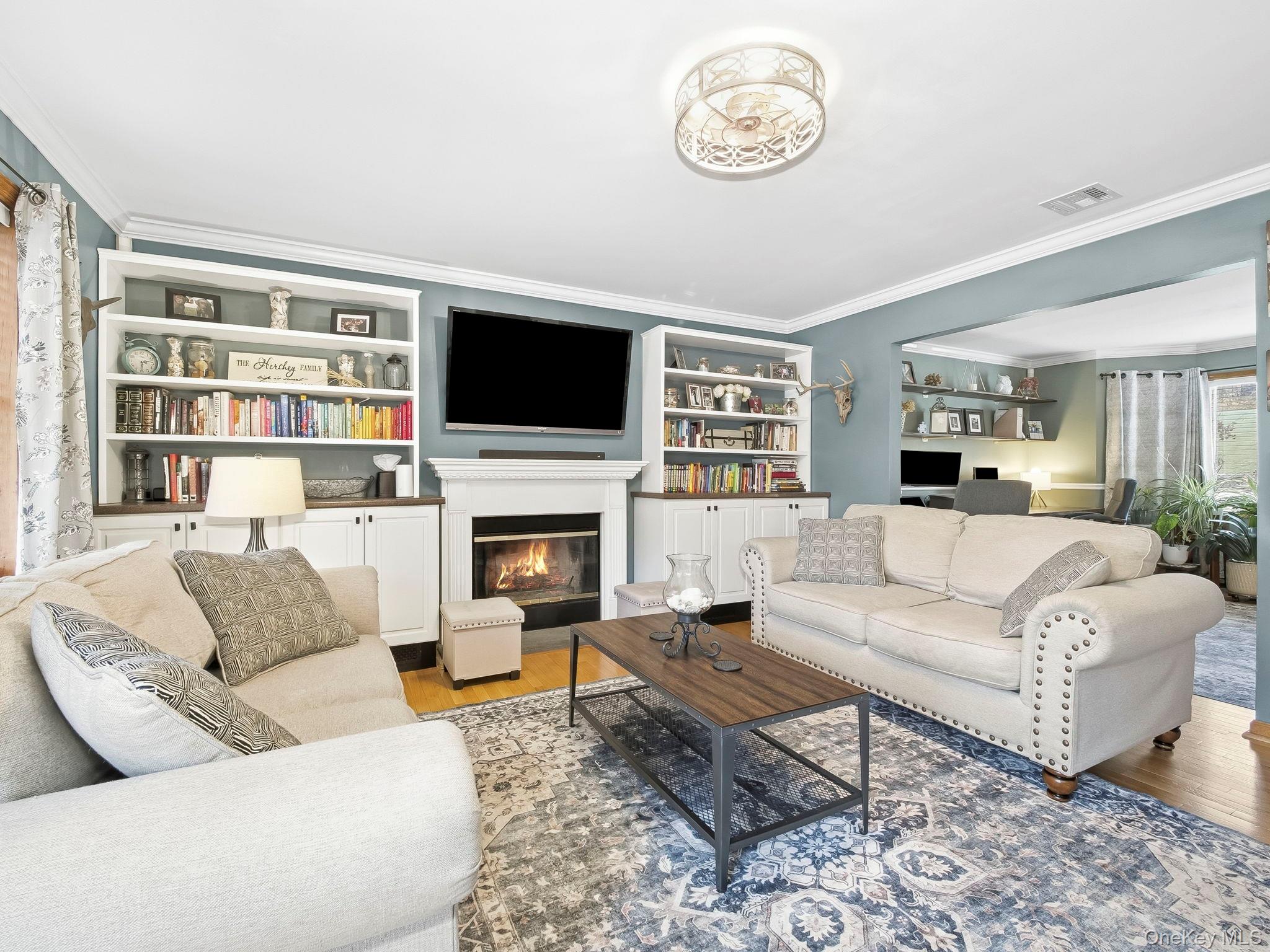 90 Reilly Road LaGrangeville, NY 12540 - Photo 18 of 50 a living room with furniture a flat screen tv and a fireplace