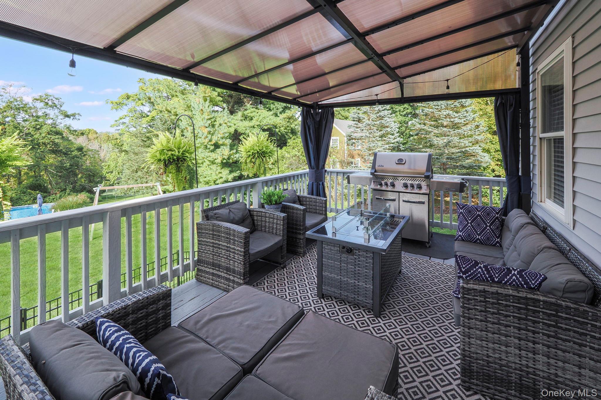 90 Reilly Road LaGrangeville, NY 12540 - Photo 20 of 50 a balcony with furniture and a garden