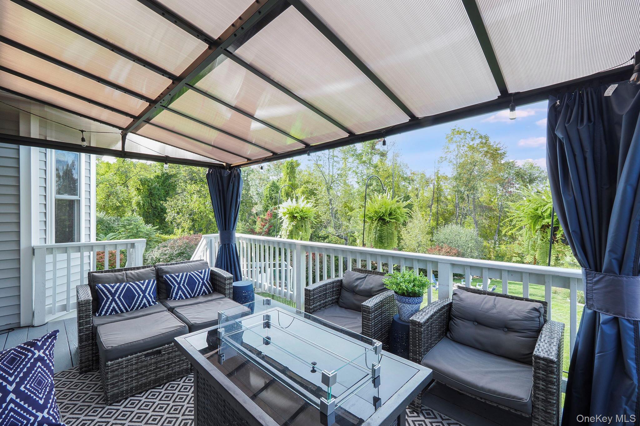 90 Reilly Road LaGrangeville, NY 12540 - Photo 22 of 50 a balcony with furniture and floor to ceiling windows