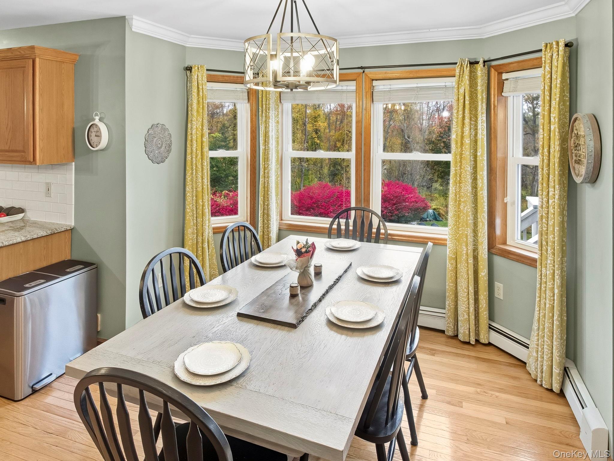 90 Reilly Road LaGrangeville, NY 12540 - Photo 27 of 50 a view of a dining room with furniture large windows and wooden floor