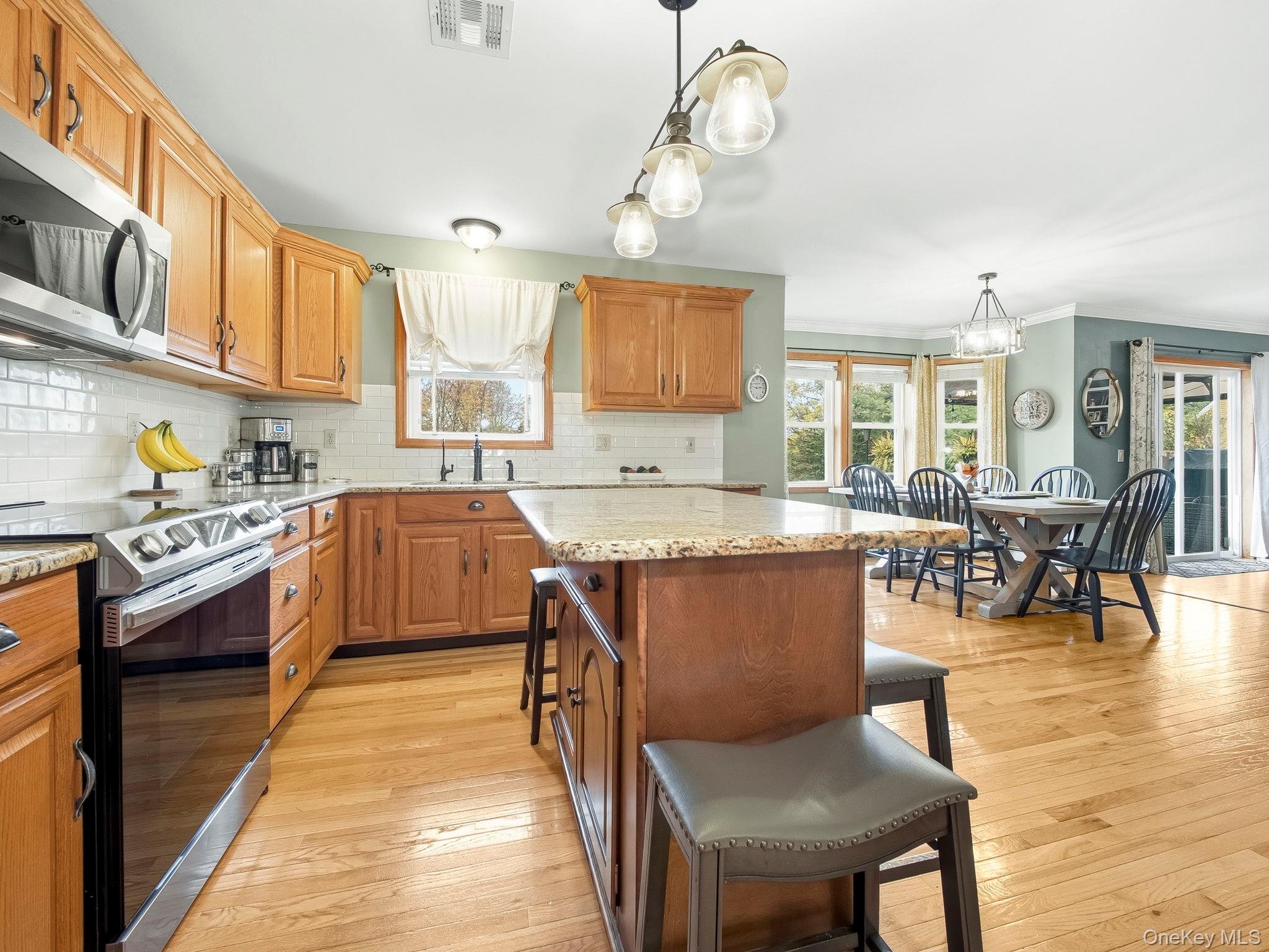90 Reilly Road LaGrangeville, NY 12540 - Photo 31 of 50 a kitchen with stainless steel appliances granite countertop sink stove top oven and cabinets
