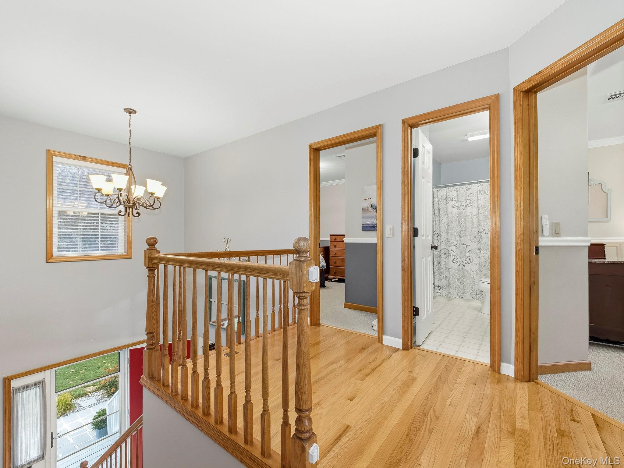 90 Reilly Road LaGrangeville, NY 12540 - Photo 36 of 50 a view of a room with wooden floor windows and a chandelier