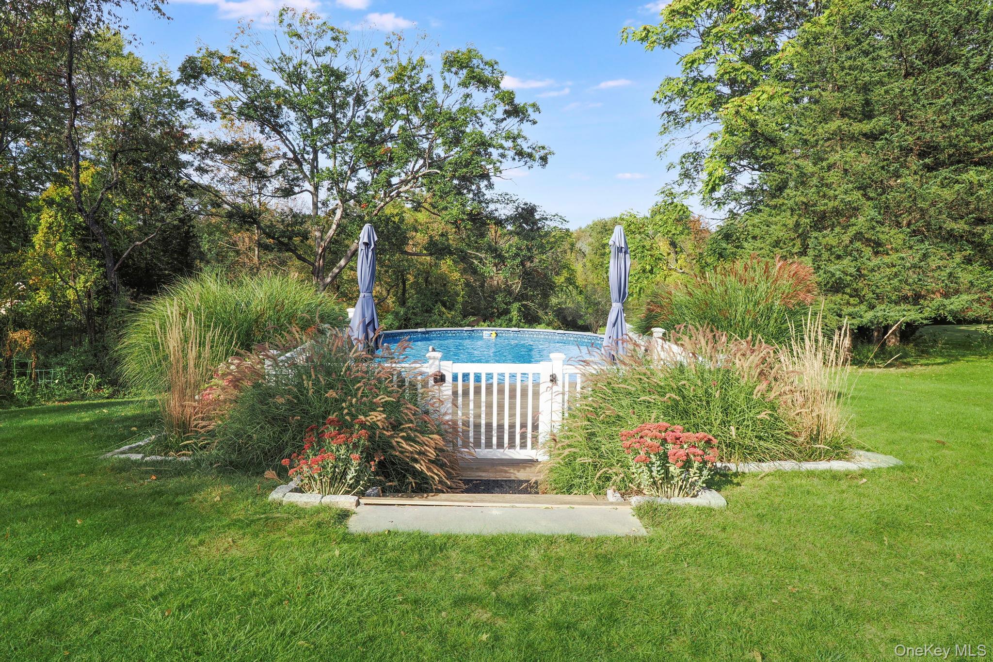 90 Reilly Road LaGrangeville, NY 12540 - Photo 8 of 50 a view of a chair and table in the garden