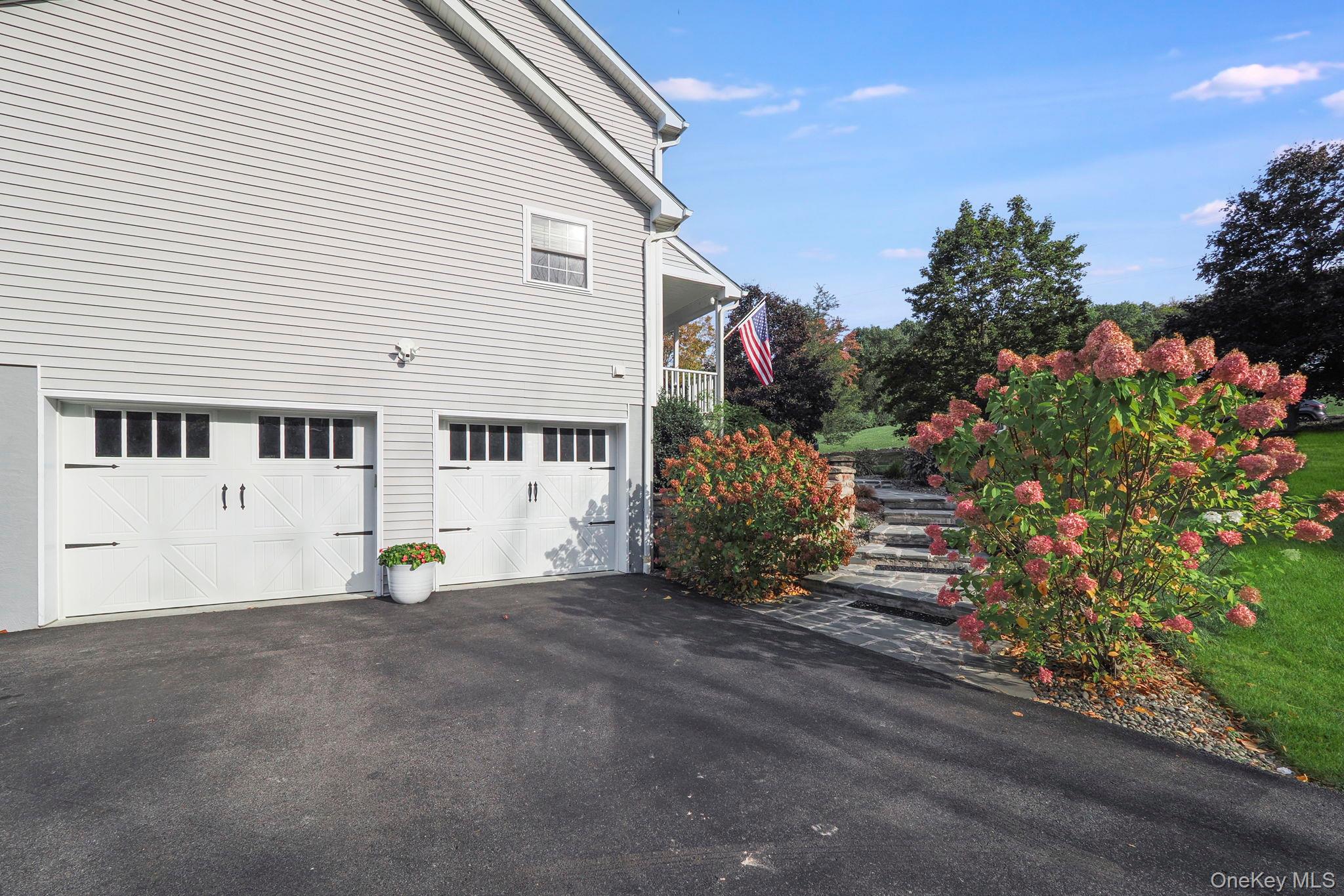 90 Reilly Road LaGrangeville, NY 12540 - Photo 9 of 50 a front view of a house with a garden