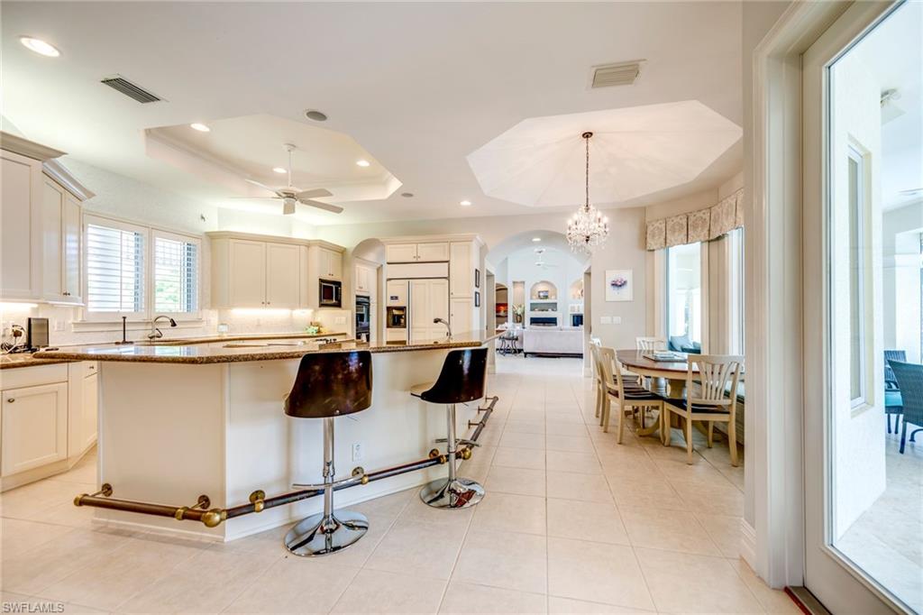 1160 Oleander Drive Naples, FL 34102 - Photo 12 of 31 a room with lots of table chair