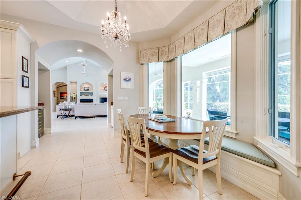 1160 Oleander Drive Naples, FL 34102 - Photo 13 of 31 a view of a dining room with furniture and a chandelier