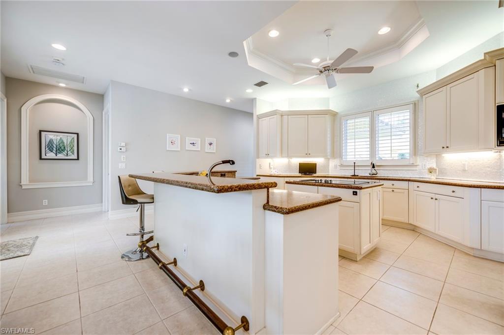 1160 Oleander Drive Naples, FL 34102 - Photo 16 of 31 a kitchen with a sink cabinets and window