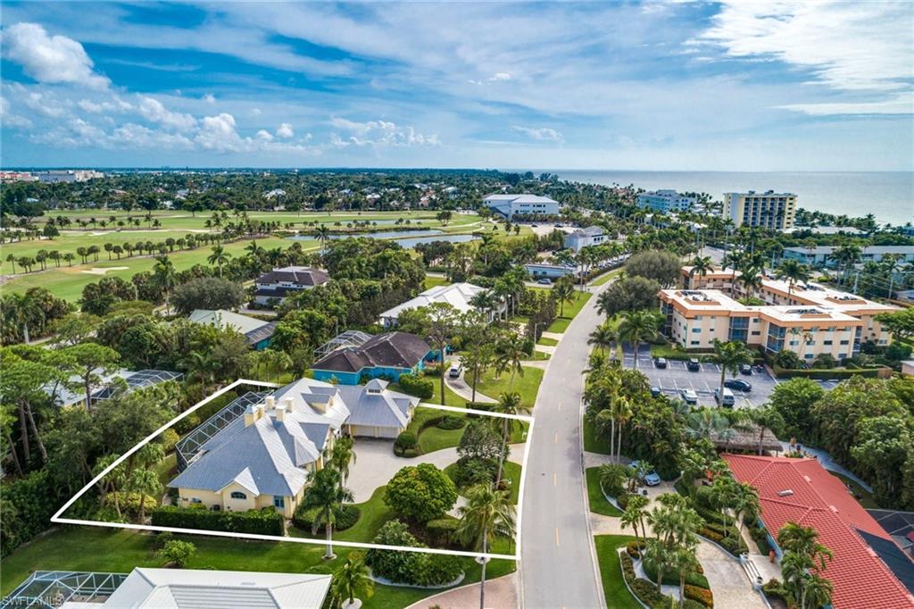 1160 Oleander Drive Naples, FL 34102 - Photo 3 of 31 an aerial view of residential building and car parked