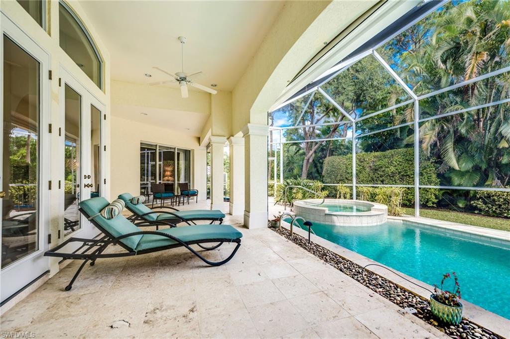 1160 Oleander Drive Naples, FL 34102 - Photo 31 of 31 a view of a patio with chairs and table in balcony