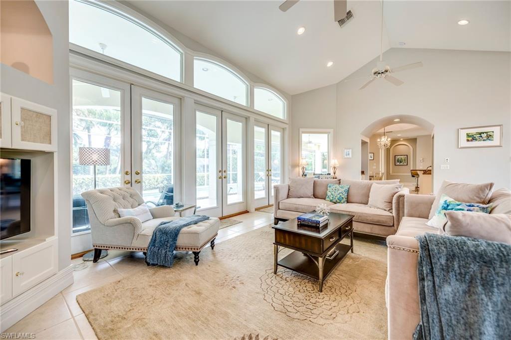1160 Oleander Drive Naples, FL 34102 - Photo 6 of 31 a living room with furniture and large windows