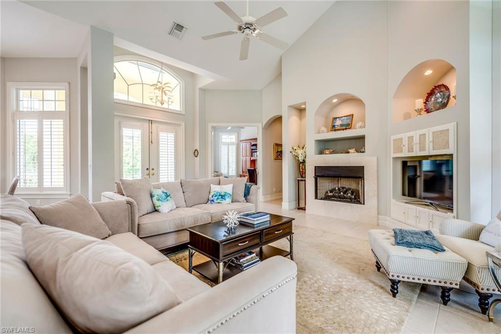 1160 Oleander Drive Naples, FL 34102 - Photo 7 of 31 a living room with furniture and a flat screen tv