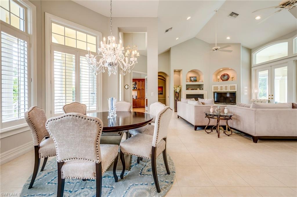 1160 Oleander Drive Naples, FL 34102 - Photo 8 of 31 a view of a dining room with furniture and a large window