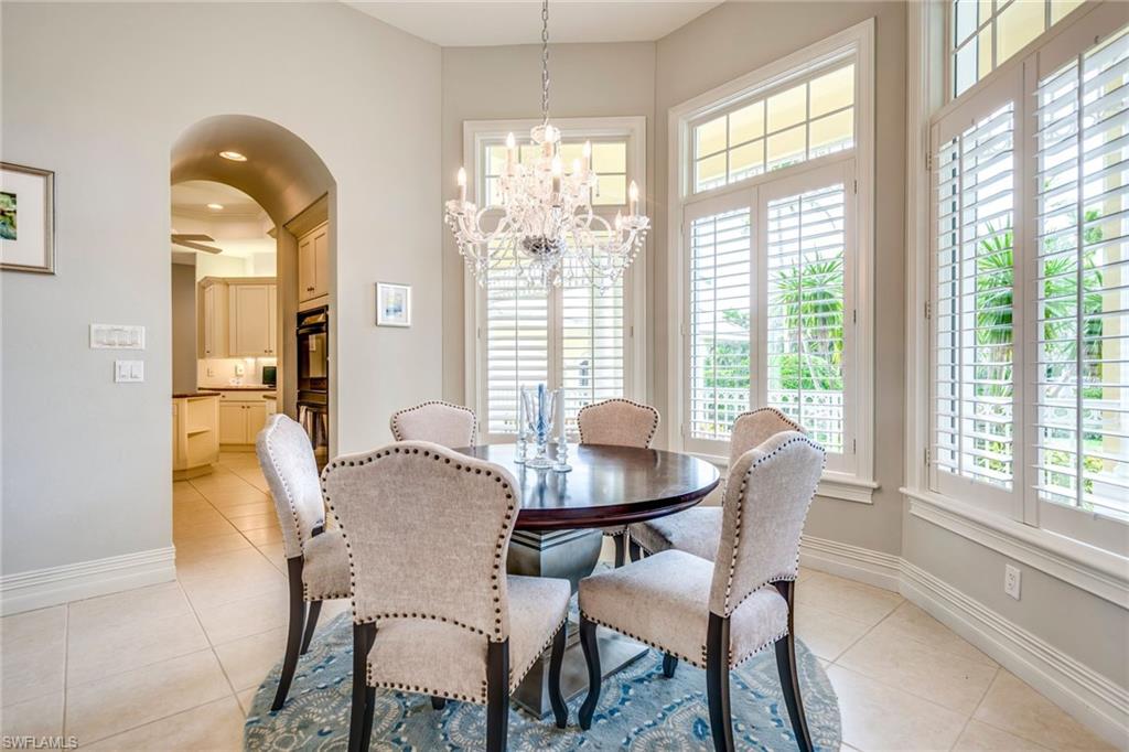 1160 Oleander Drive Naples, FL 34102 - Photo 10 of 31 a view of a dining room with furniture and windows