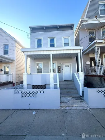 front view of a house with a street