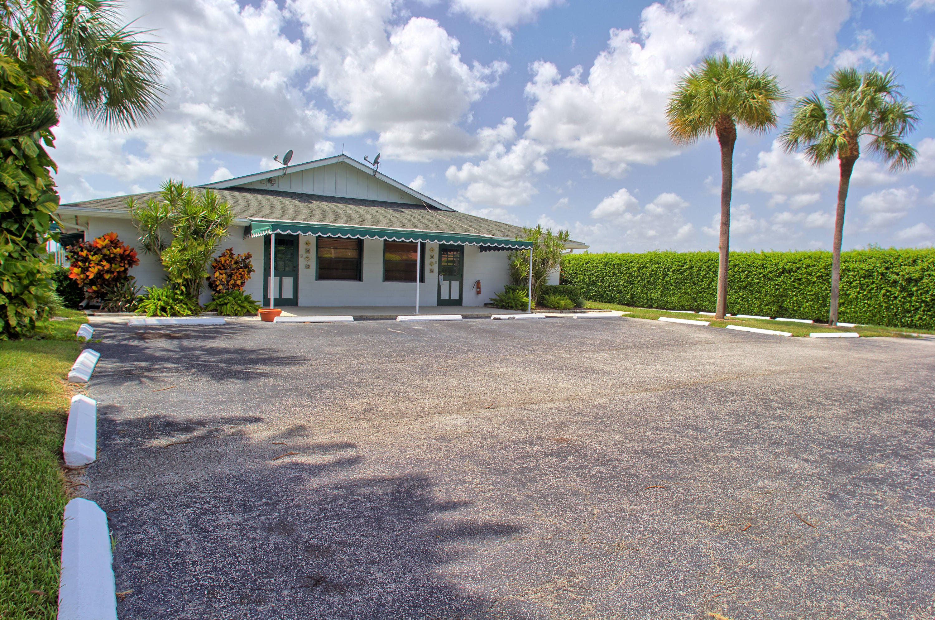 13135 Southfields Road Wellington, FL 33414 - Photo 3 of 16 Front with Parking