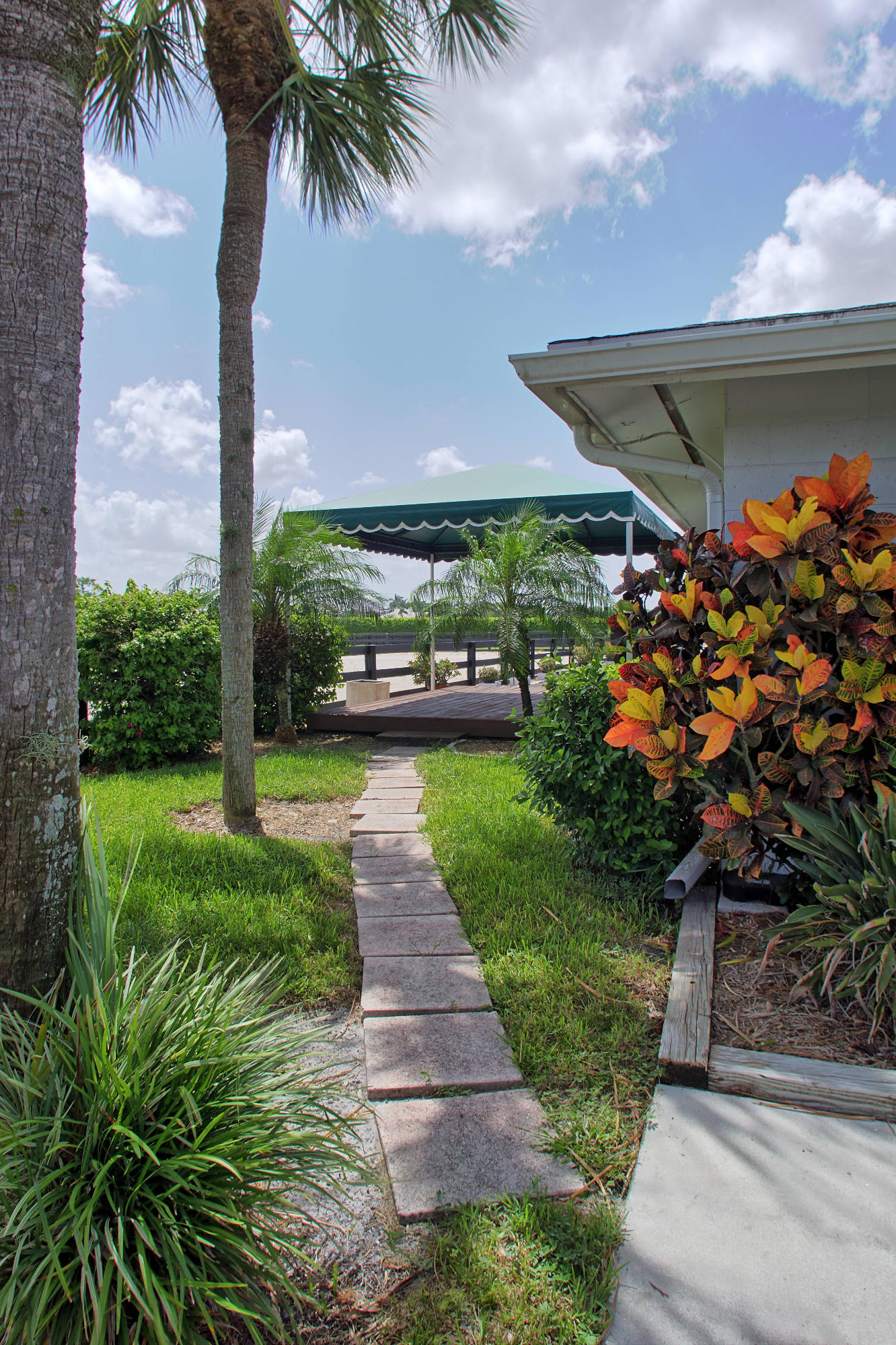 13135 Southfields Road Wellington, FL 33414 - Photo 8 of 16 Path to Deck from Parking