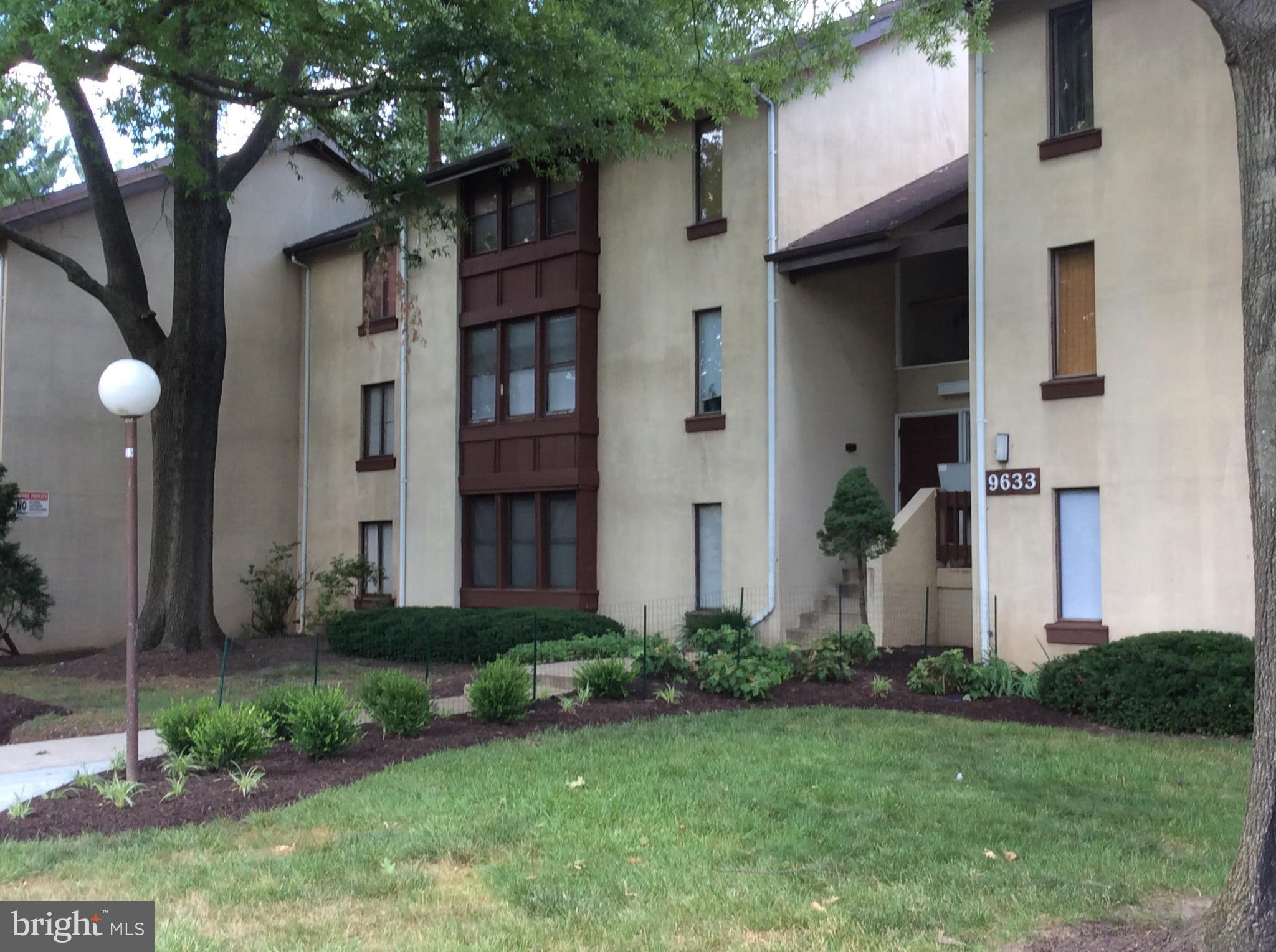 9633 White Acre Road, Unit A2 Columbia, MD 21045 - Photo 1 of 27 a front view of a house with garden