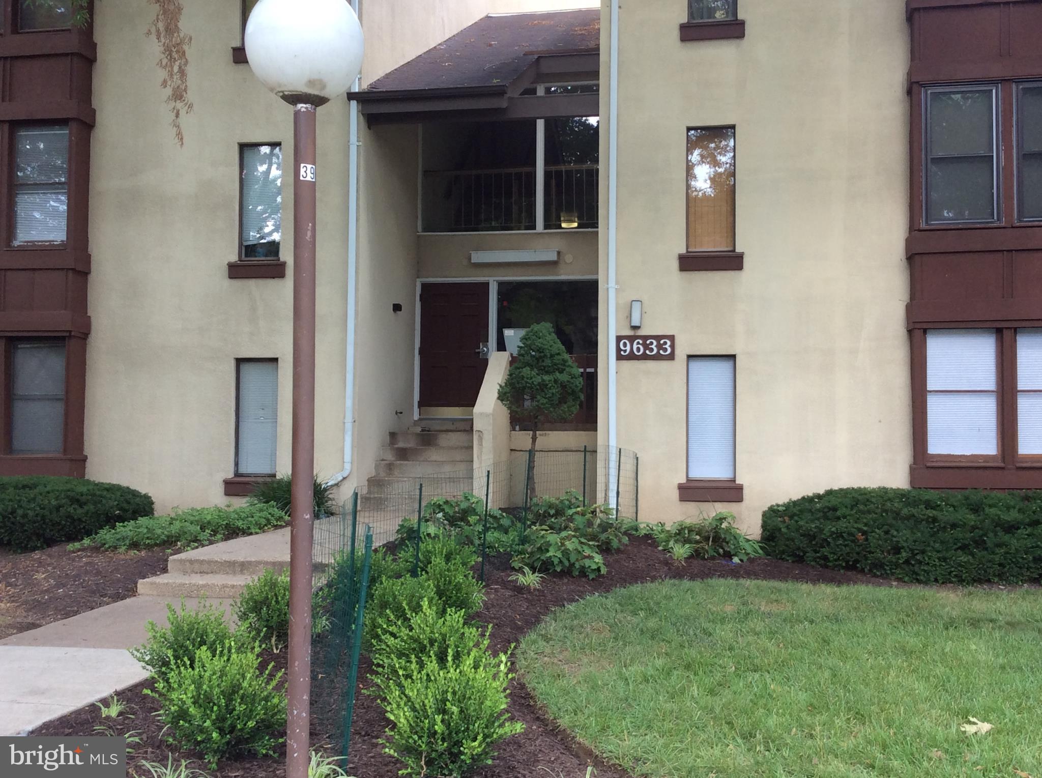 9633 White Acre Road, Unit A2 Columbia, MD 21045 - Photo 2 of 27 a front view of a house with garden