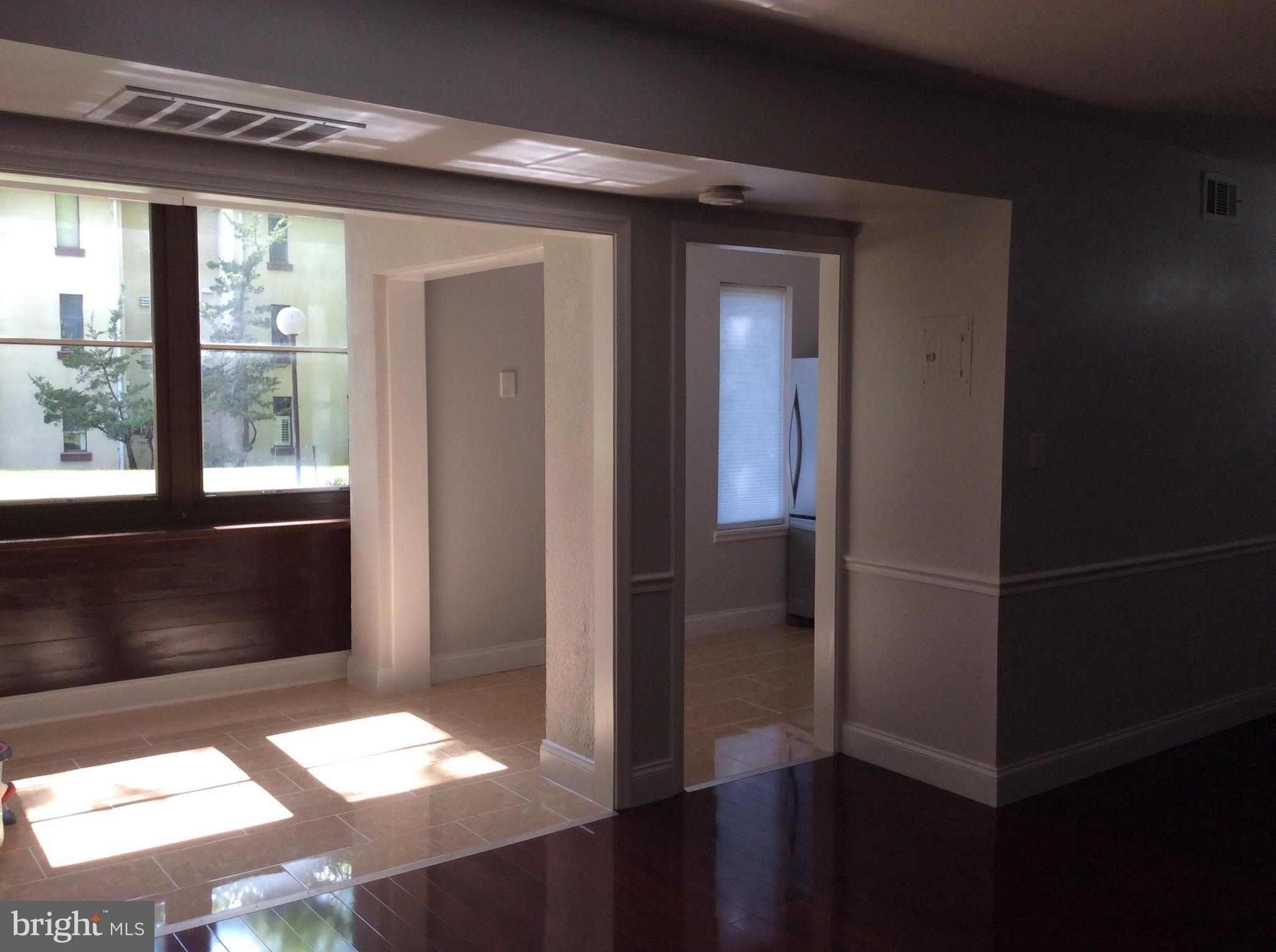 9633 White Acre Road, Unit A2 Columbia, MD 21045 - Photo 12 of 27 a bathroom with a glass shower door