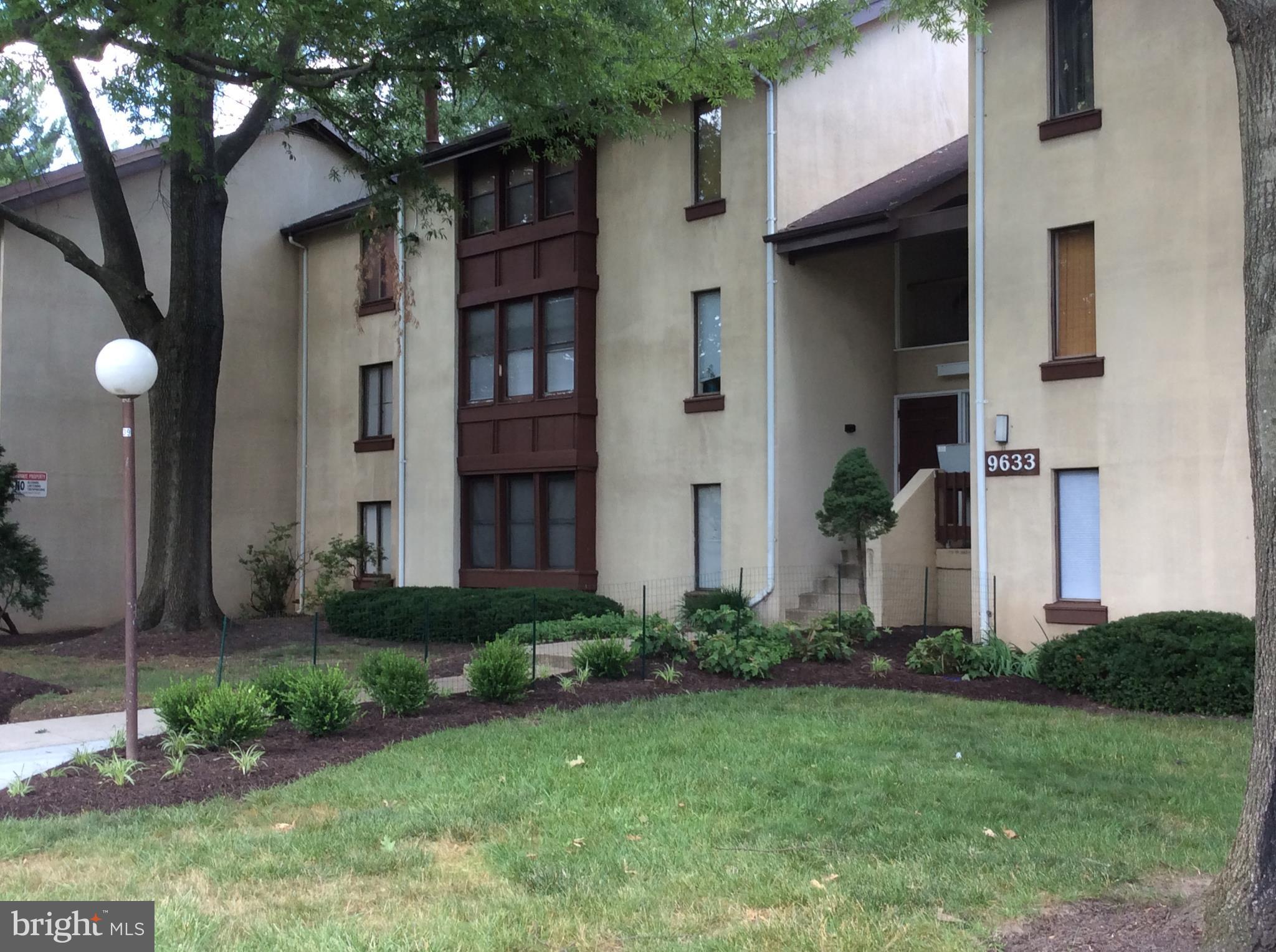 9633 White Acre Road, Unit A2 Columbia, MD 21045 - Photo 3 of 27 a front view of a house with garden