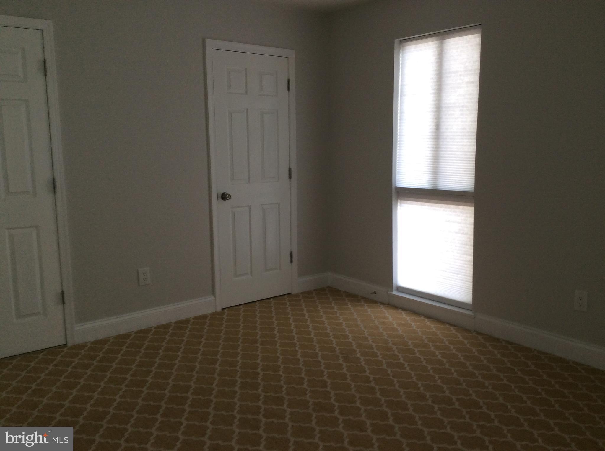 9633 White Acre Road, Unit A2 Columbia, MD 21045 - Photo 21 of 27 a view of an empty room and window