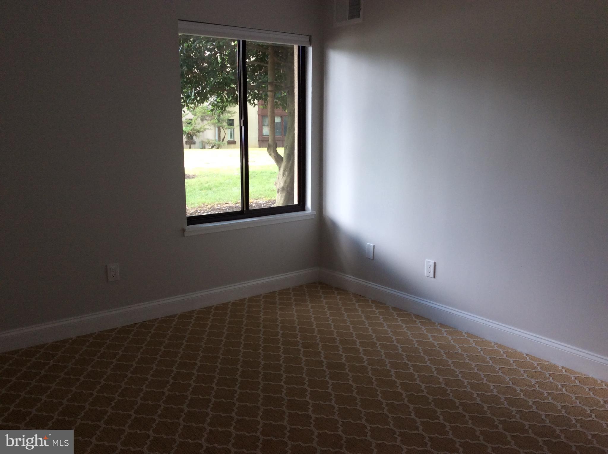 9633 White Acre Road, Unit A2 Columbia, MD 21045 - Photo 23 of 27 an empty room with a window