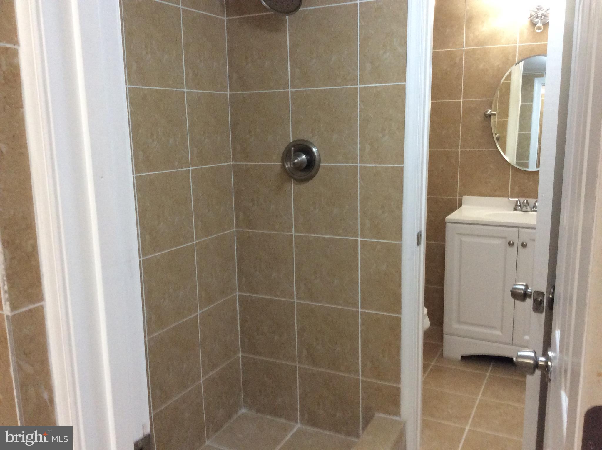 9633 White Acre Road, Unit A2 Columbia, MD 21045 - Photo 26 of 27 a bathroom with a shower