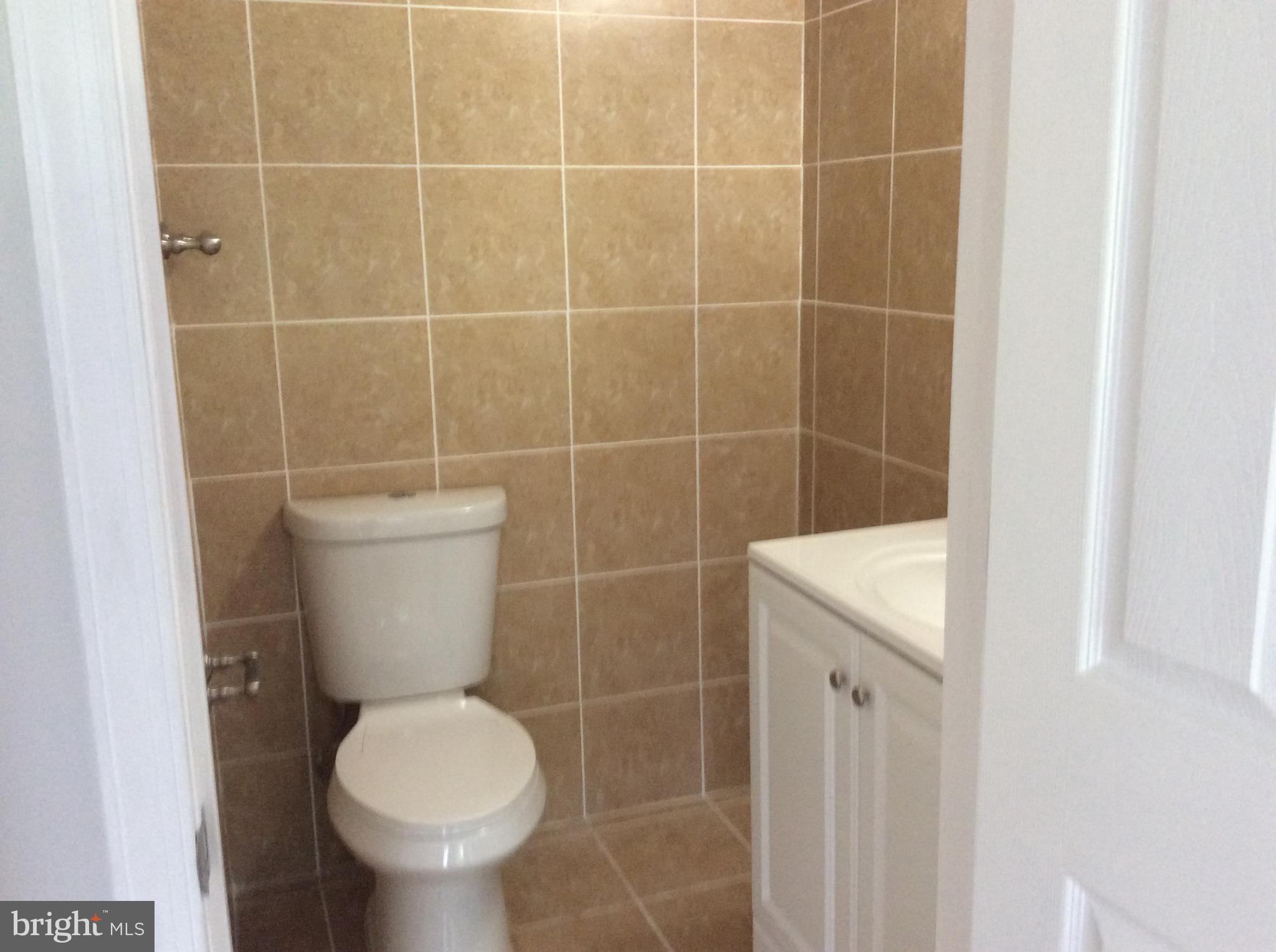 9633 White Acre Road, Unit A2 Columbia, MD 21045 - Photo 27 of 27 a bathroom with a toilet