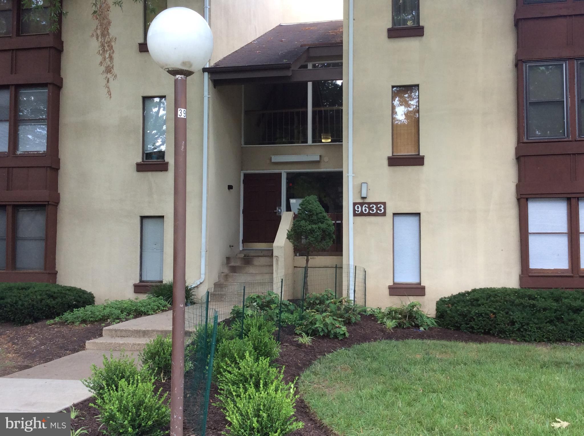 9633 White Acre Road, Unit A2 Columbia, MD 21045 - Photo 4 of 27 a front view of a house with garden