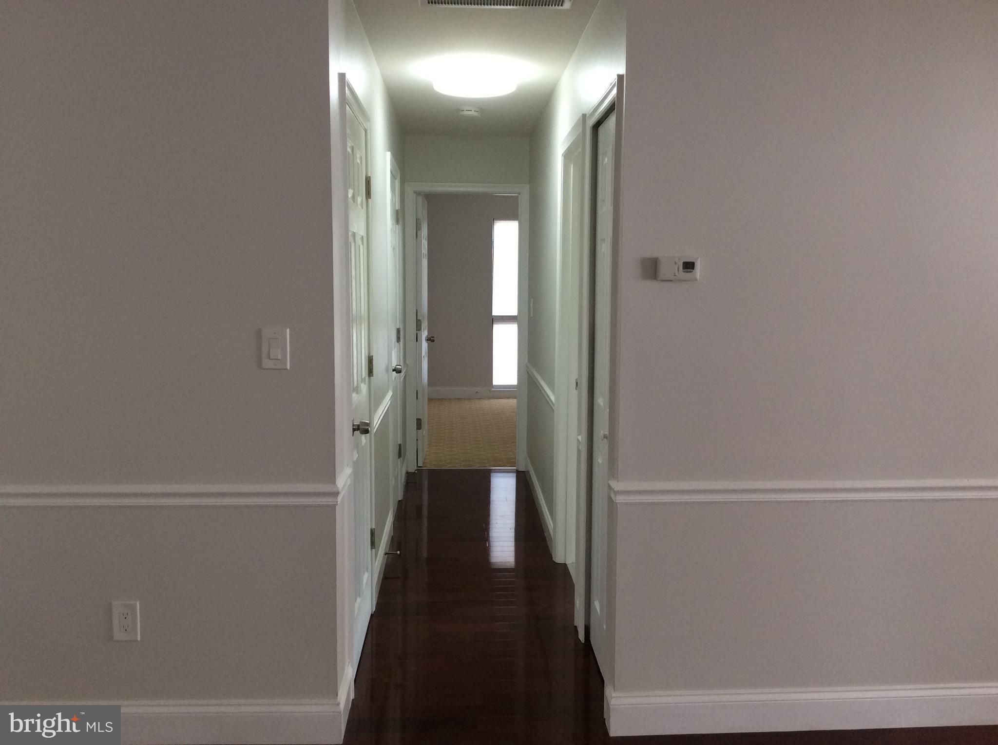 9633 White Acre Road, Unit A2 Columbia, MD 21045 - Photo 10 of 27 a view of a hallway