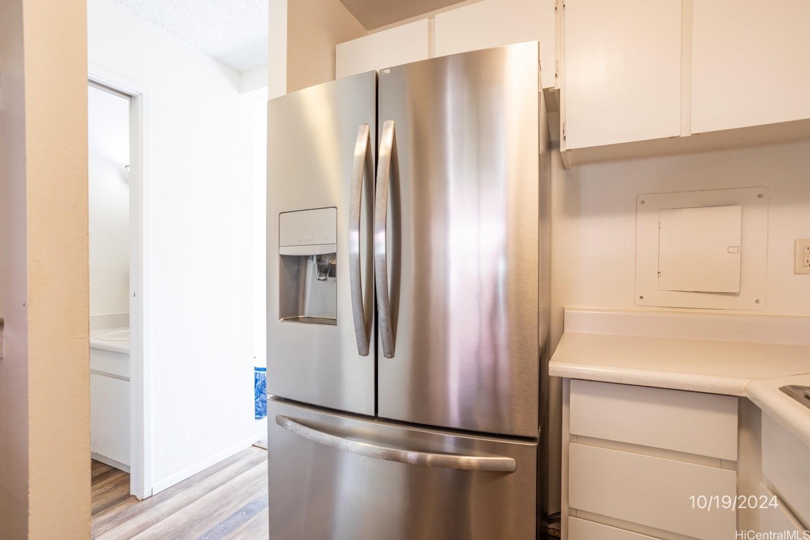 94-112 Anania Drive, Unit 219 Mililani, HI 96789 - Photo 14 of 25 a metallic refrigerator freezer sitting in a kitchen