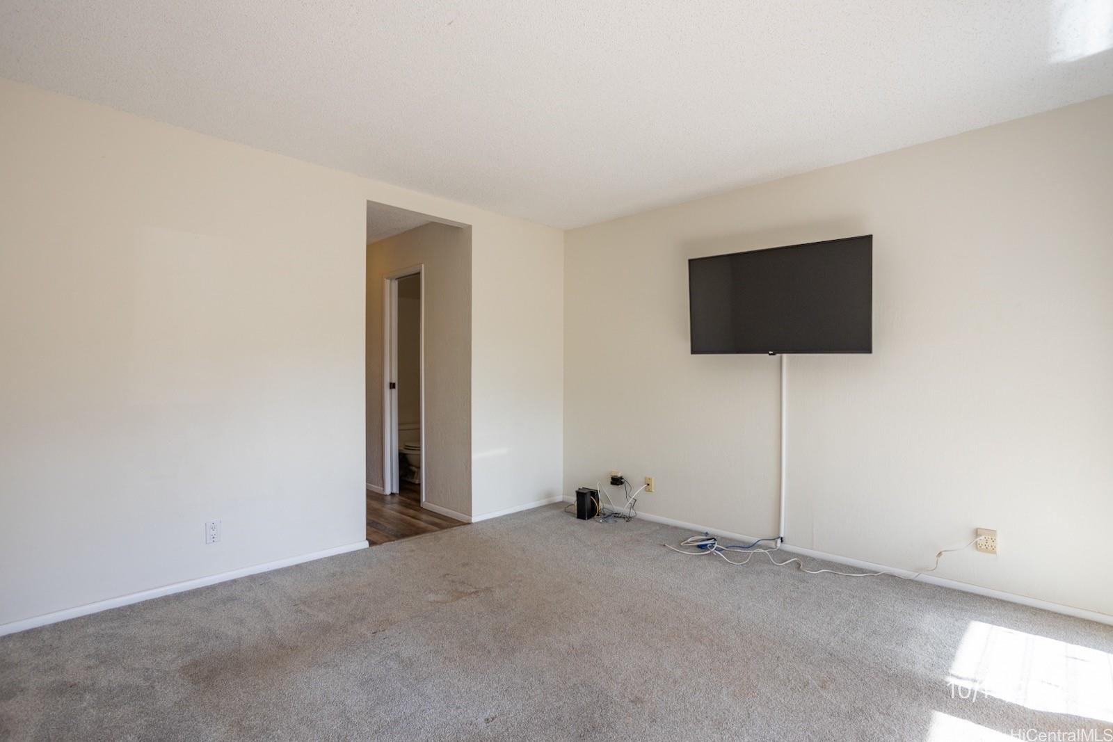 94-112 Anania Drive, Unit 219 Mililani, HI 96789 - Photo 16 of 25 a view of a livingroom with a flat screen tv