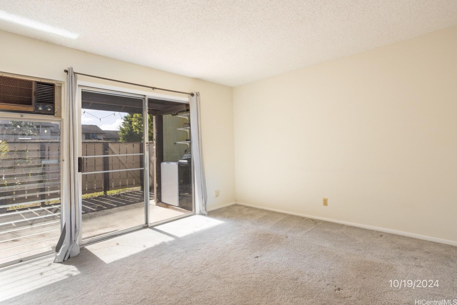94-112 Anania Drive, Unit 219 Mililani, HI 96789 - Photo 18 of 25 a view of an empty room with a fireplace