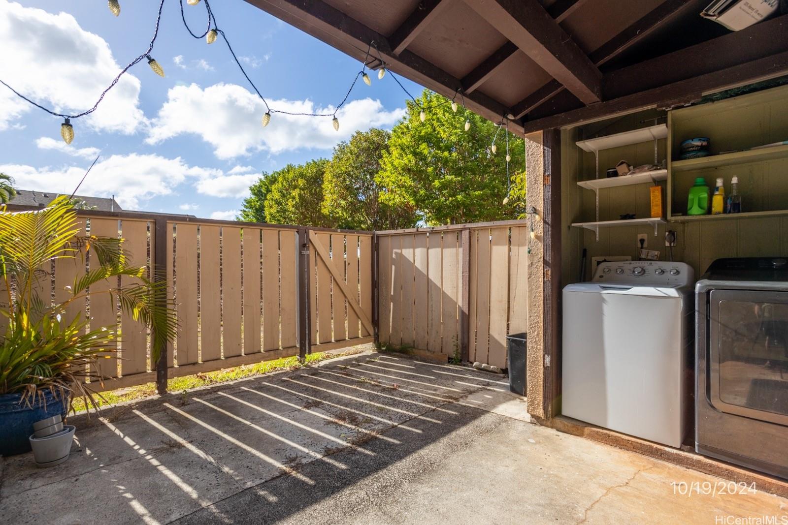 94-112 Anania Drive, Unit 219 Mililani, HI 96789 - Photo 3 of 25 a view of outdoor space and wooden deck