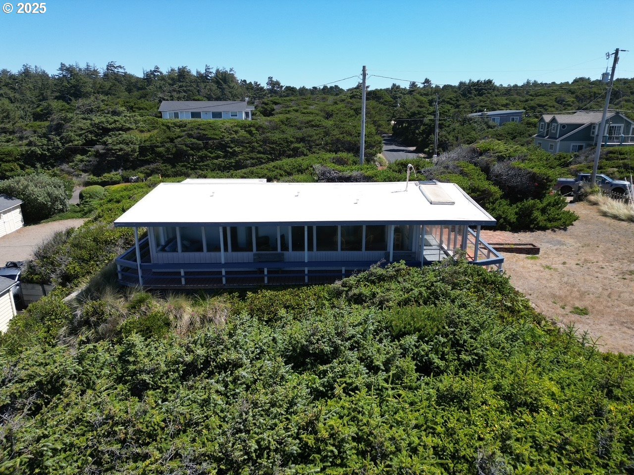 88632 3rd Avenue Florence, OR 97439 - Photo 11 of 43 a view of a house with a yard and sitting area