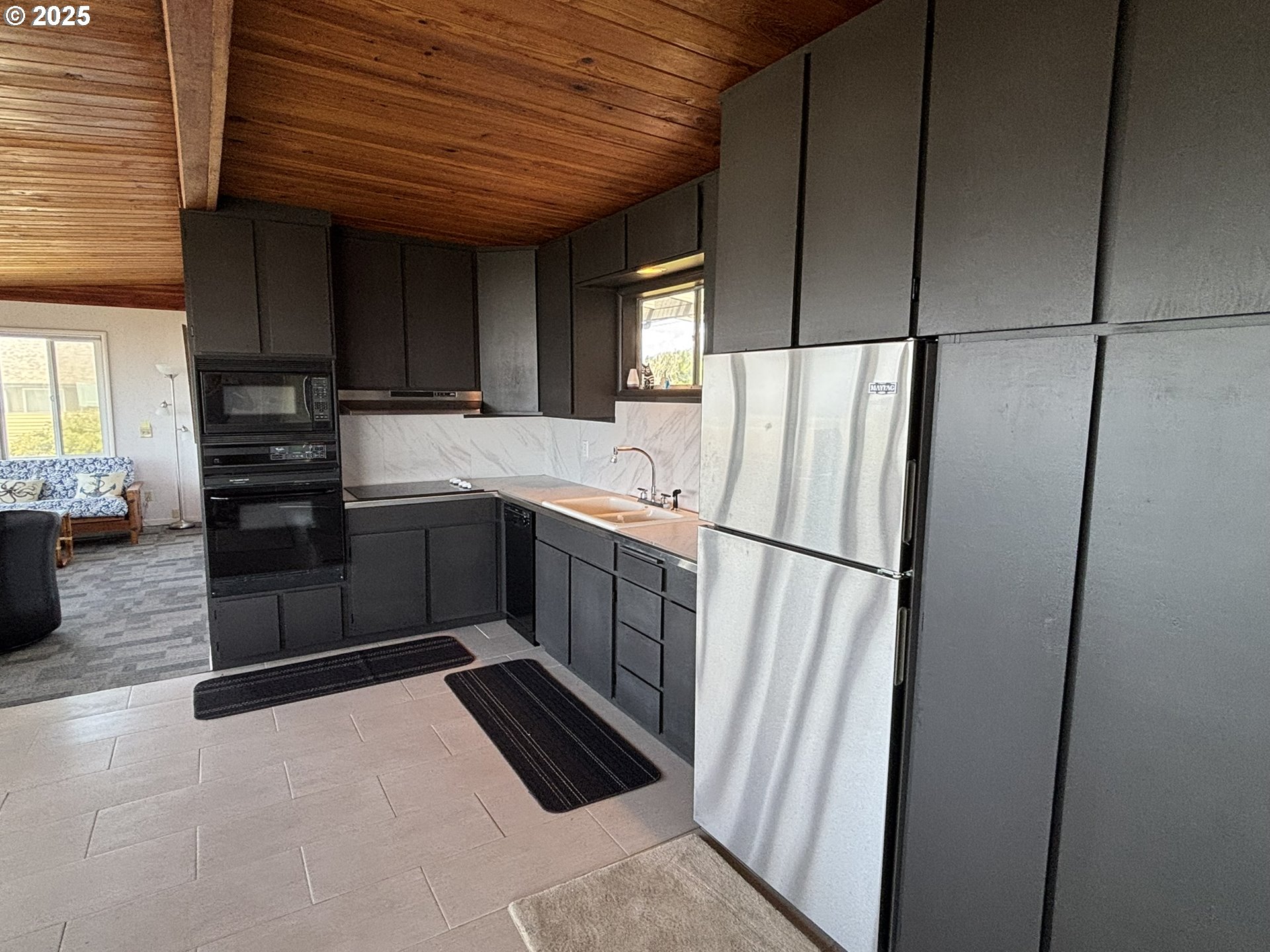 88632 3rd Avenue Florence, OR 97439 - Photo 24 of 43 a kitchen with stainless steel appliances a refrigerator and a sink