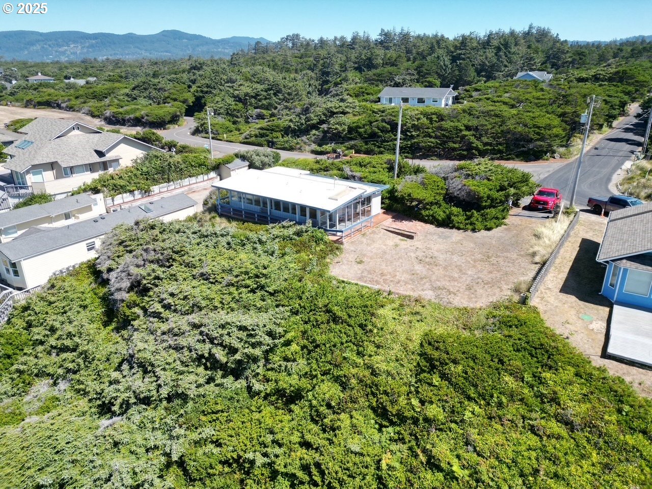 88632 3rd Avenue Florence, OR 97439 - Photo 7 of 43 an aerial view of a house with mountain view