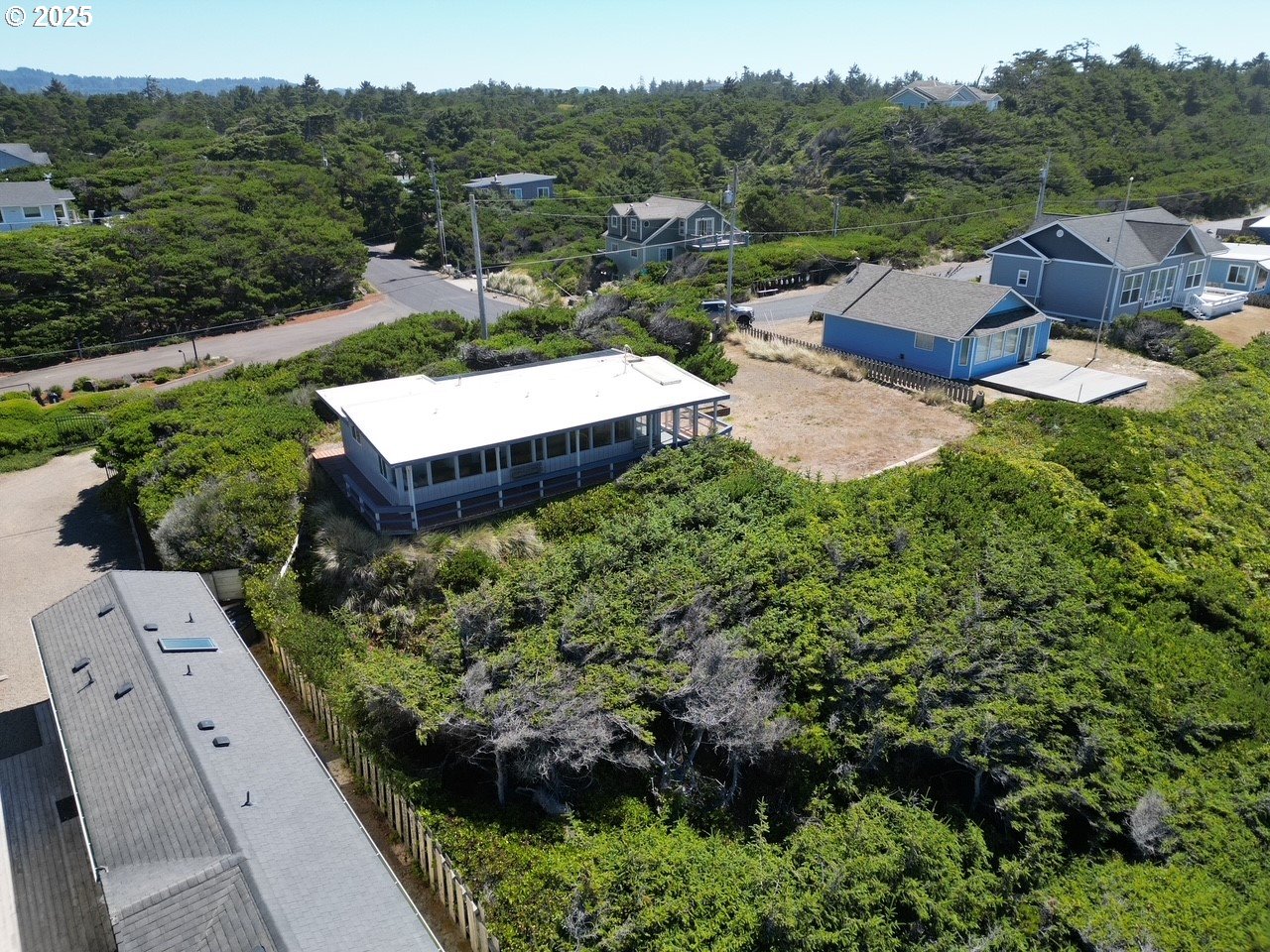 88632 3rd Avenue Florence, OR 97439 - Photo 8 of 43 an aerial view of a house with a garden