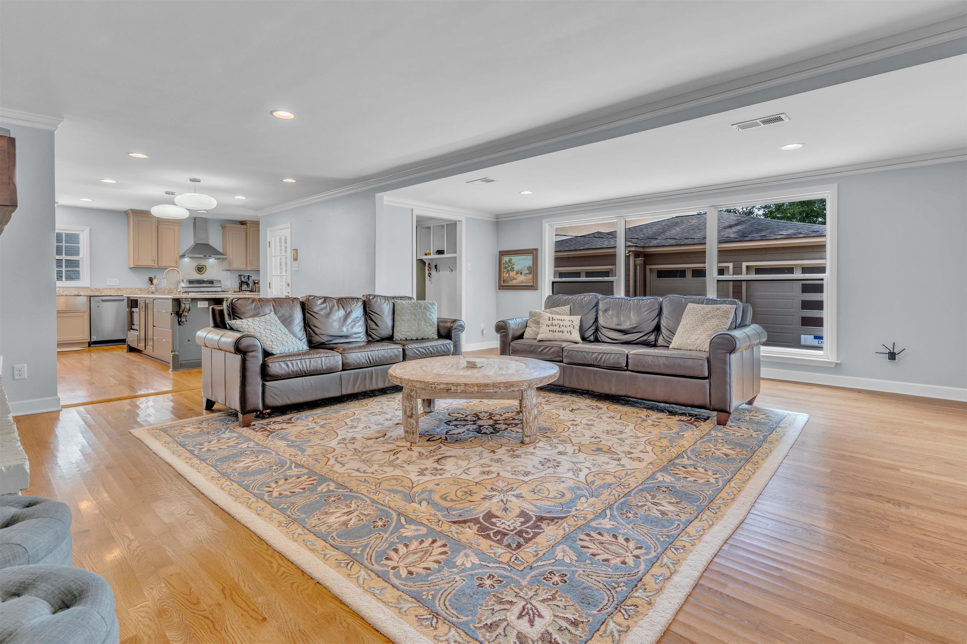 5187 South Angela Road Memphis, TN 38117 - Photo 9 of 39 Spacious living area featuring hardwood flooring and a patterned area rug