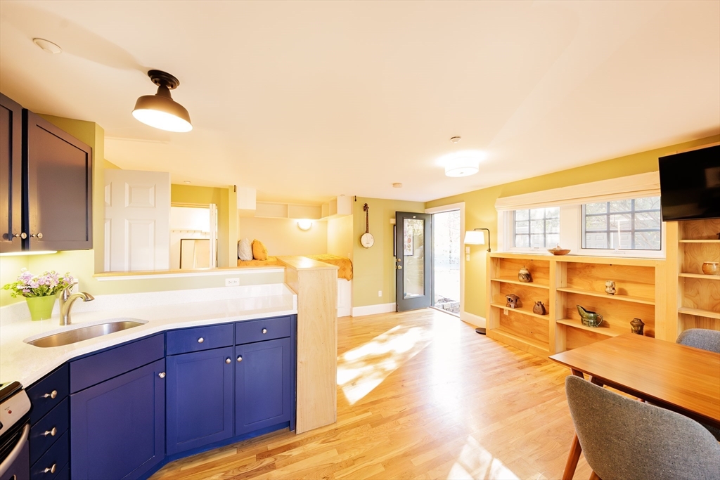 411 Norfolk Street, Unit 1F Somerville, MA 02143 - Photo 2 of 16 a spacious bathroom with a tub double vanity and a sink